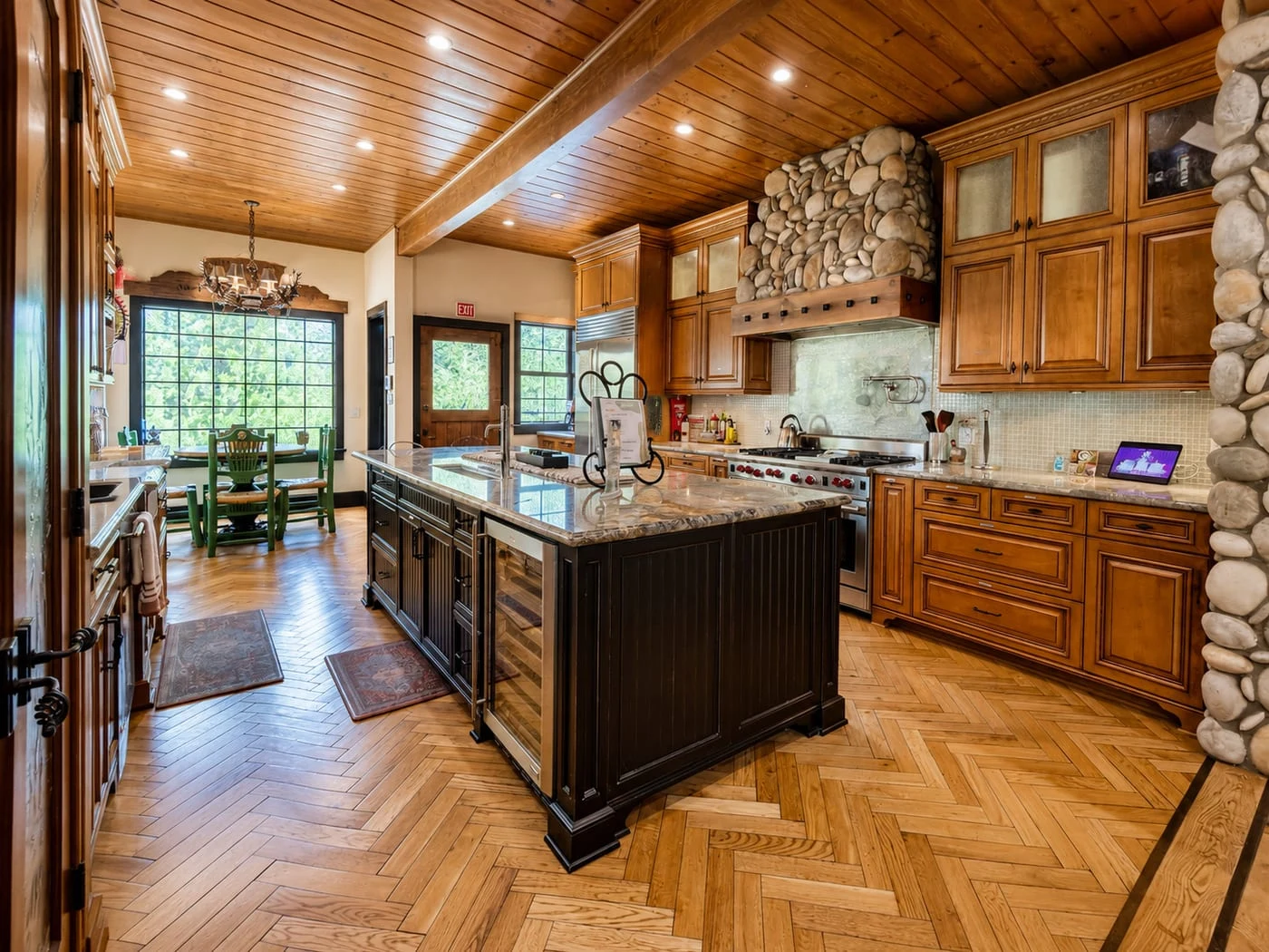 The kitchen, with a stone island and range
