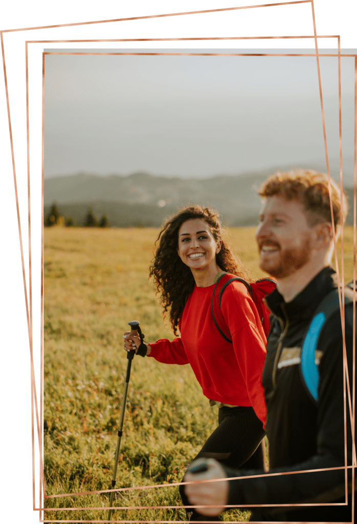 Woman and man hiking in nature.