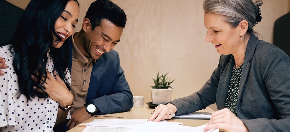 Couple going over paperwork with representative