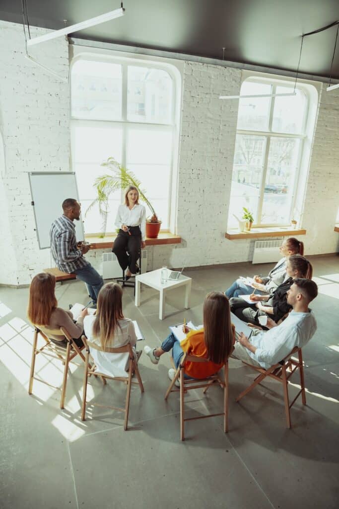 Female therapist teaching clinician-led group therapy session