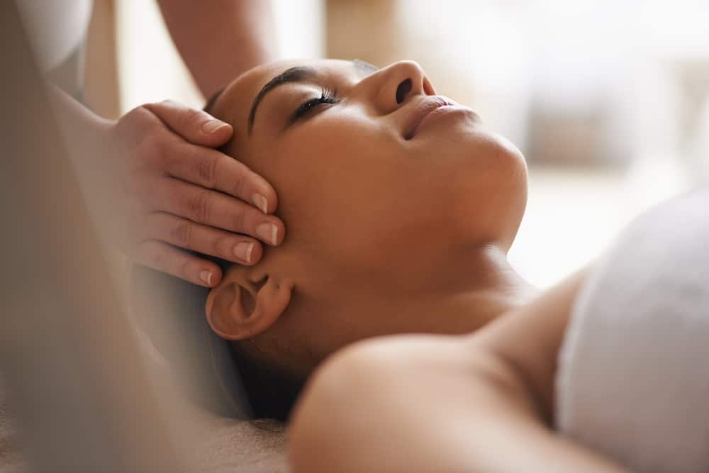 Young woman getting head massage