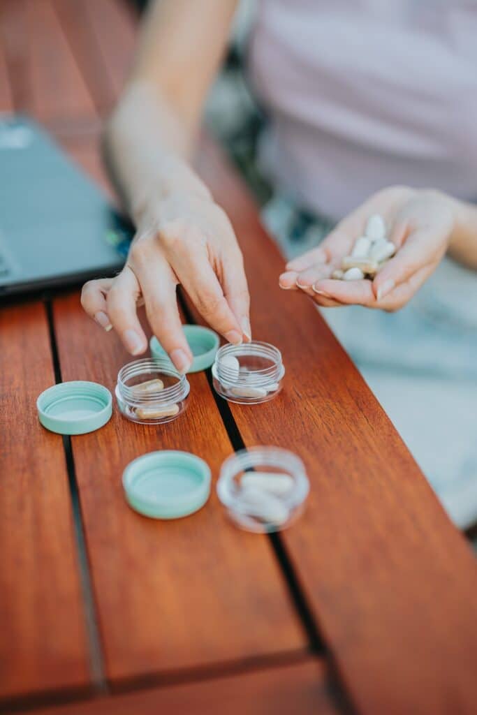 Close up hands taking pills