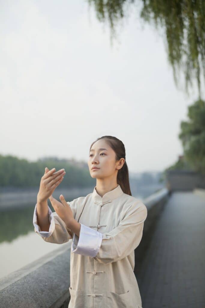 Young Woman Practicing Tai Chi