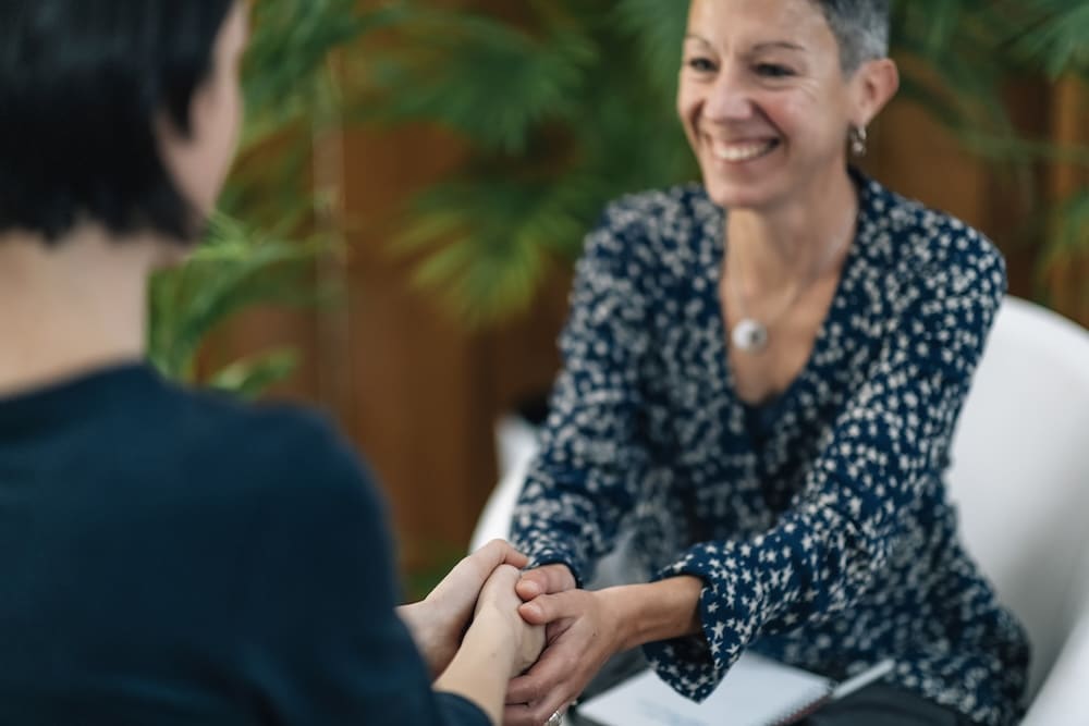 Female therapist having a session with young female client