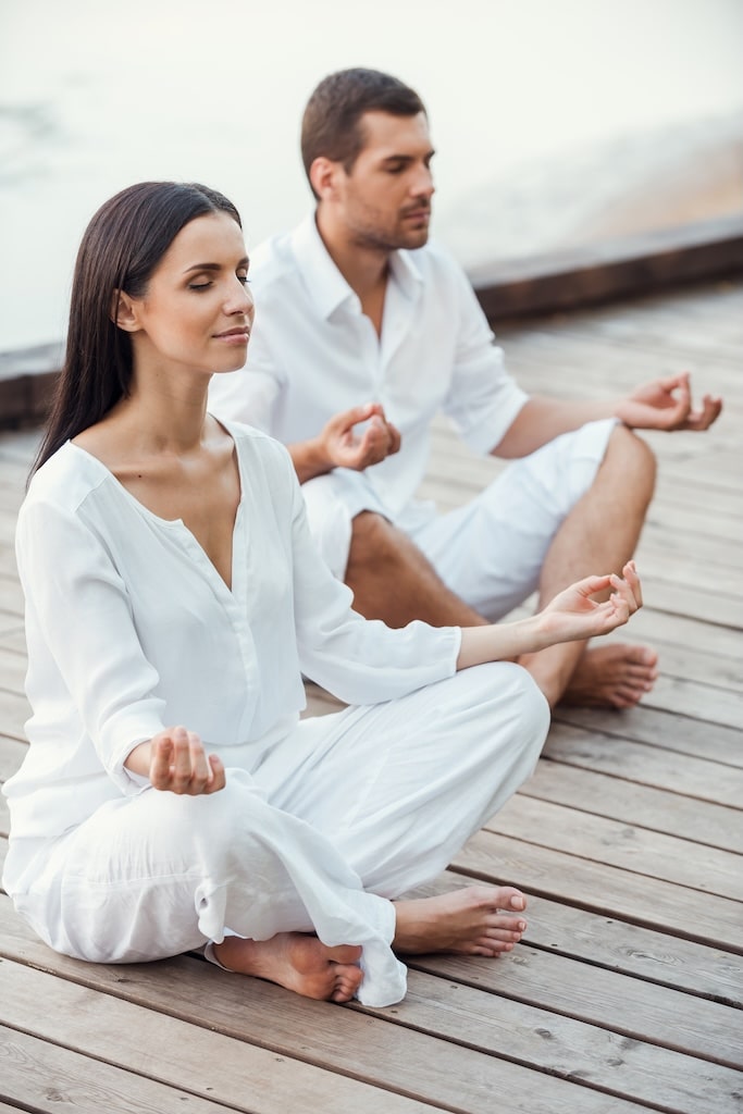 Adults meditation together.